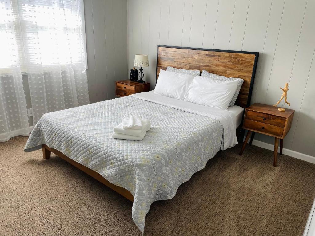 a bedroom with a bed with two towels on it at Pet friendly 3 bedroom single family house in Rehoboth Beach