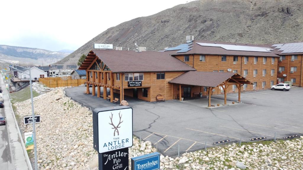 a large building with a sign in front of it at The Antler Lodge - Gardiner in Gardiner