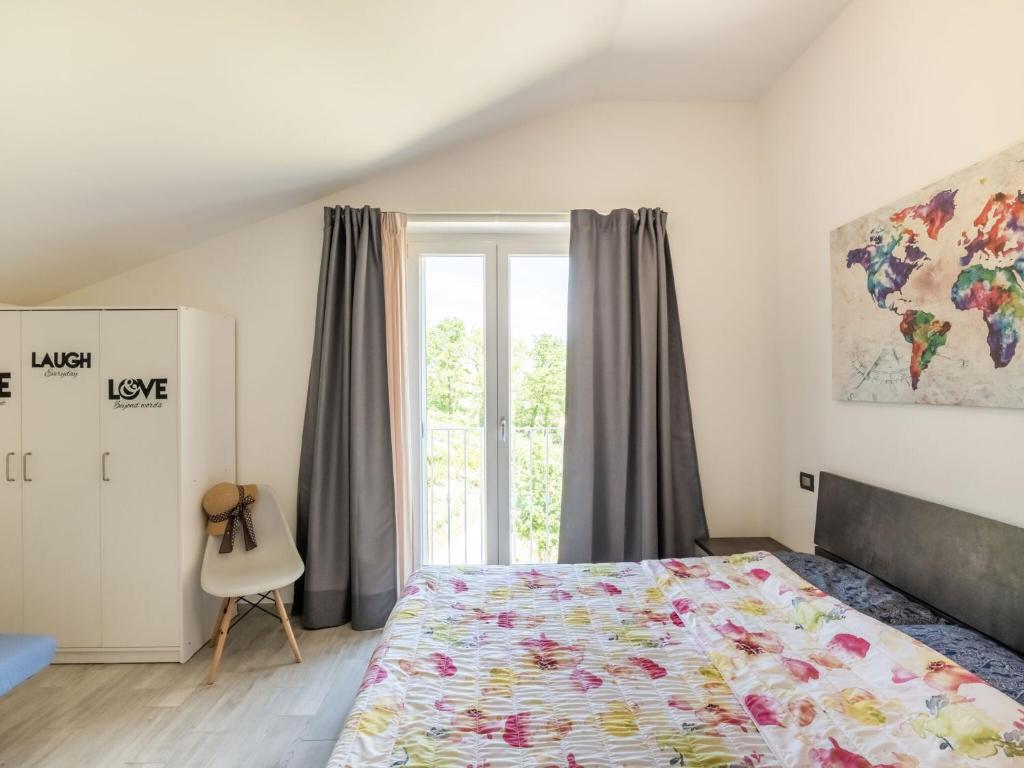 Postel nebo postele na pokoji v ubytování Apartment in Marche with Wine Experience