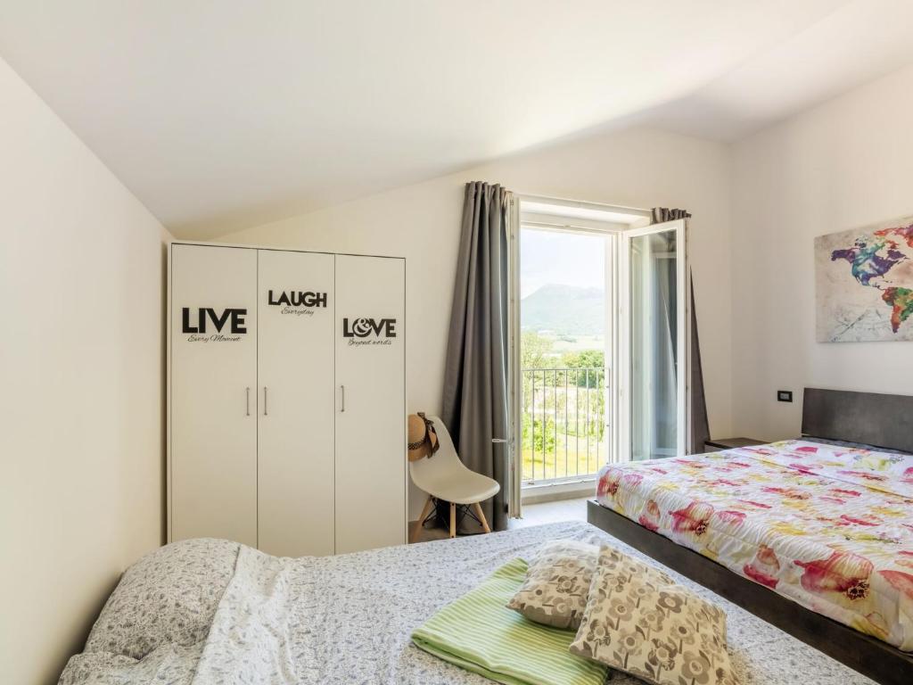 Postel nebo postele na pokoji v ubytování Apartment in Marche with Wine Experience
