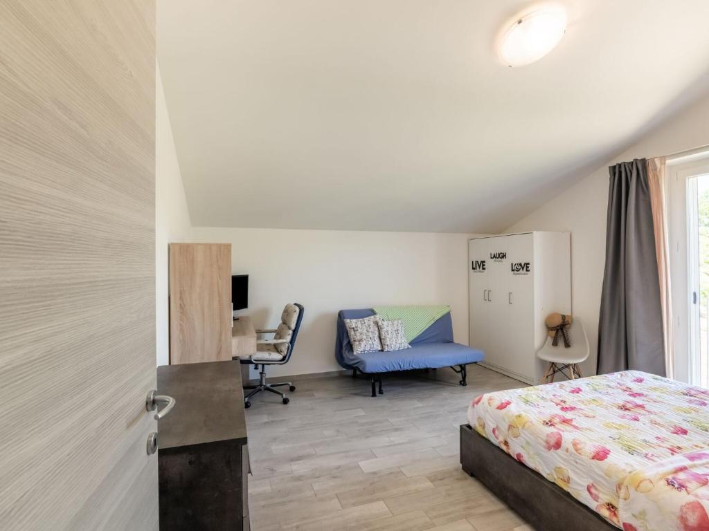 Postel nebo postele na pokoji v ubytování Apartment in Marche with Wine Experience