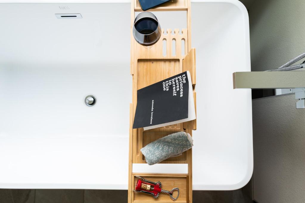 a shelf in a room next to a bed at Amorcito de Jenny - Shared House in Portland