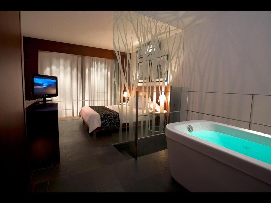 Ένα ή περισσότερα κρεβάτια σε δωμάτιο στο BTH Hotel – Boutique Concept