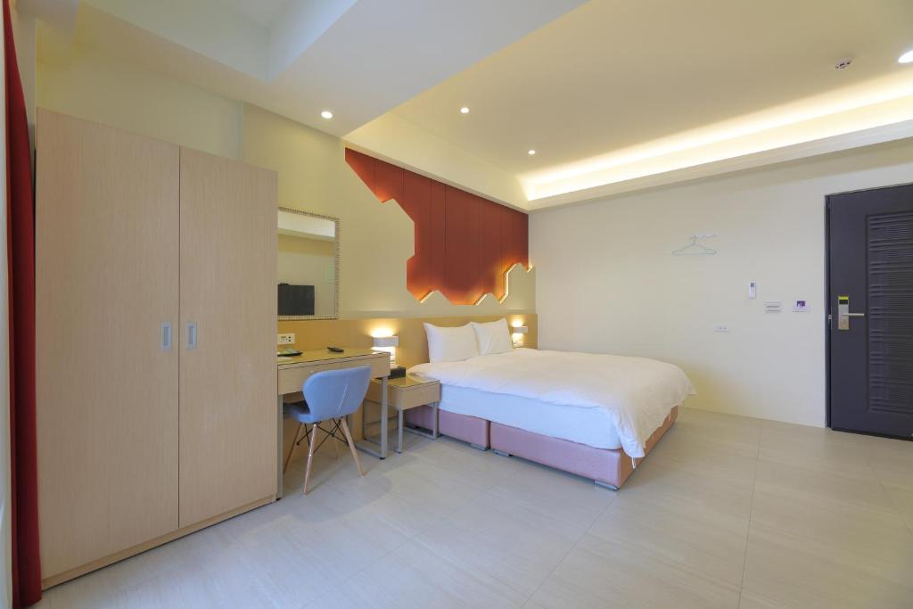 Postel nebo postele na pokoji v ubytování Donghao Hotel