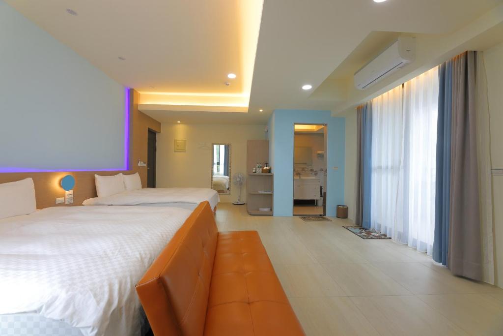 Postel nebo postele na pokoji v ubytování Donghao Hotel