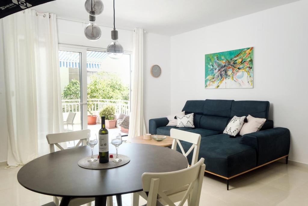 a living room with a blue couch and a table at LUXURY APARTMENT MEJE in Split