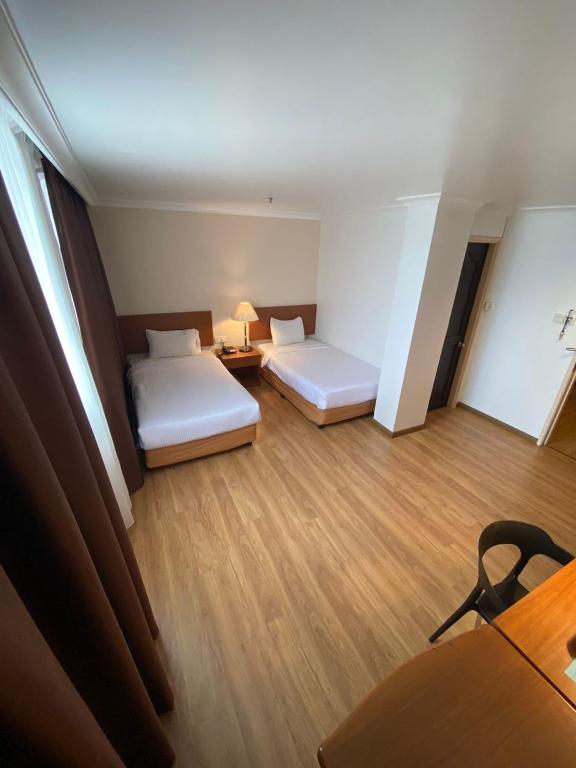 Postel nebo postele na pokoji v ubytování Kawan Hotel