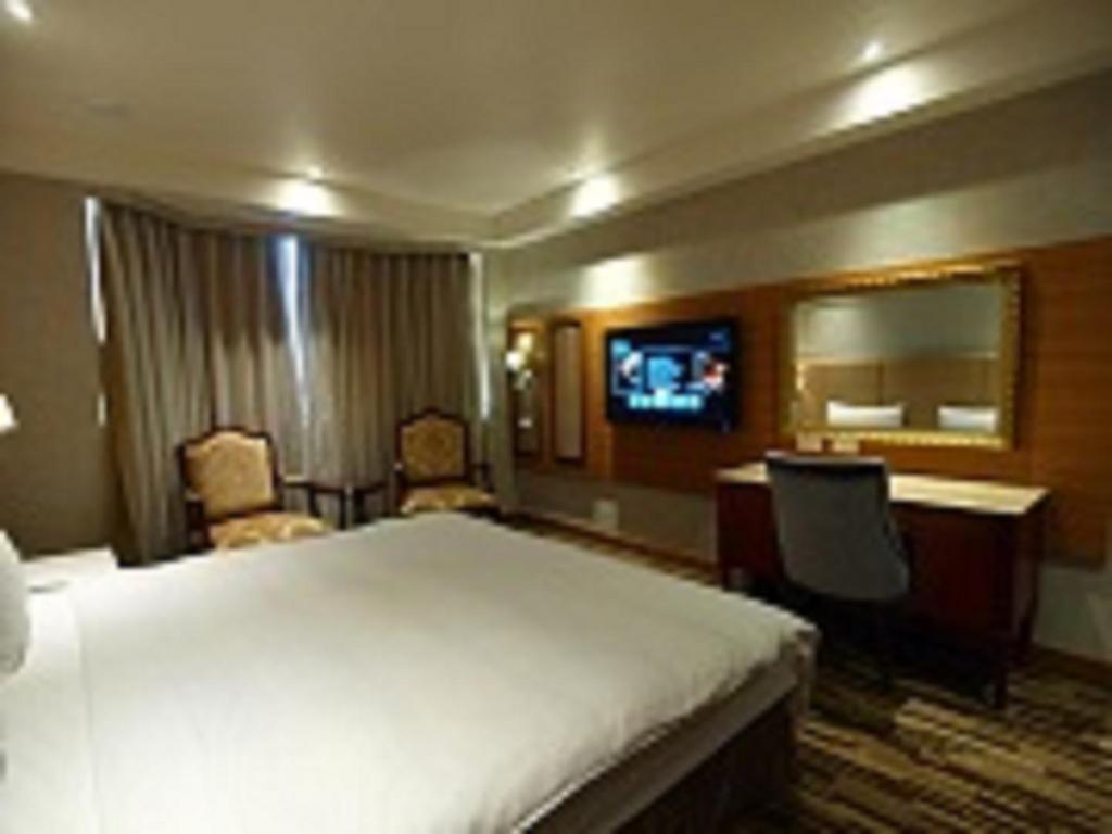 TV a/nebo společenská místnost v ubytování Grace Hotel