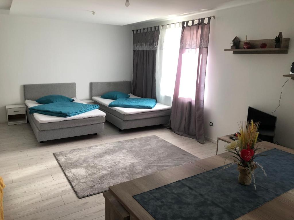 Postel nebo postele na pokoji v ubytování Appartement Willa chez willi