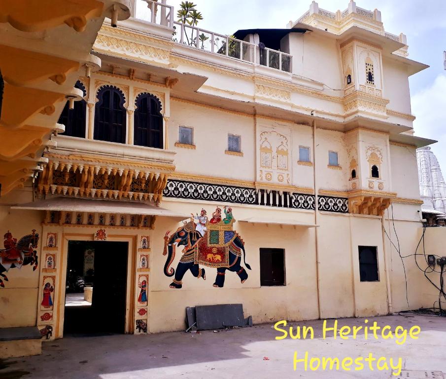 a building with an elephant painted on the side of it at Sun Heritage Home in Udaipur