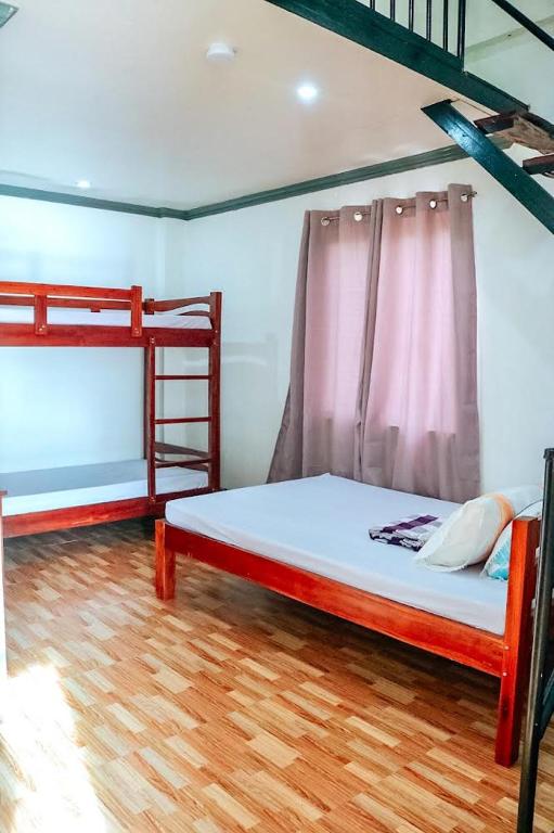 Postel nebo postele na pokoji v ubytování Airport View Hotel Vigan