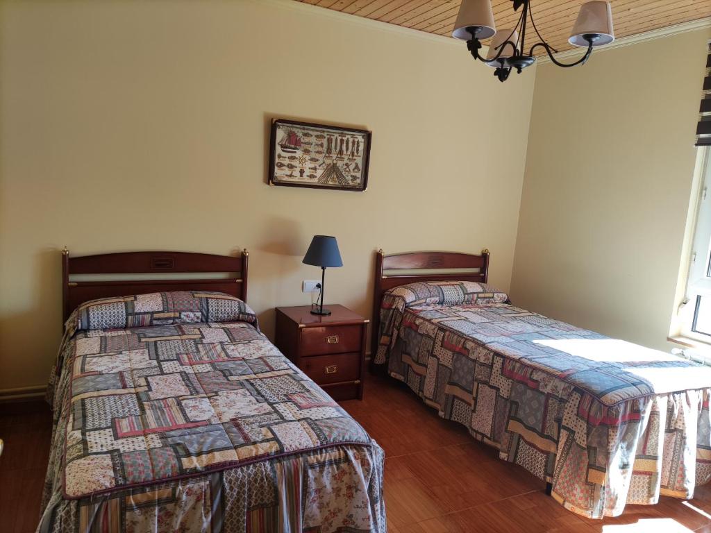 A bed or beds in a room at Casa Rural La Rasilla