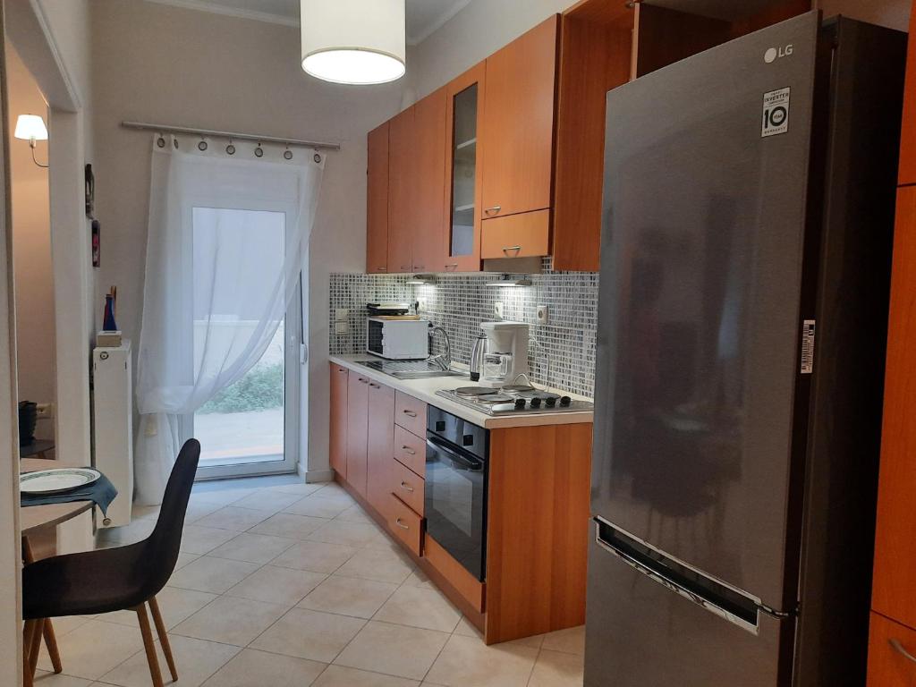 A kitchen or kitchenette at Pavlos Apartment