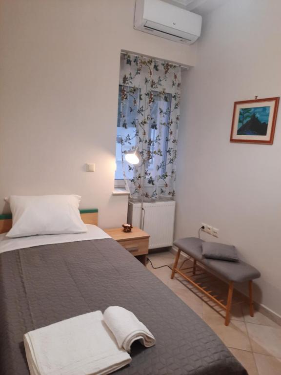 A bed or beds in a room at Pavlos Apartment