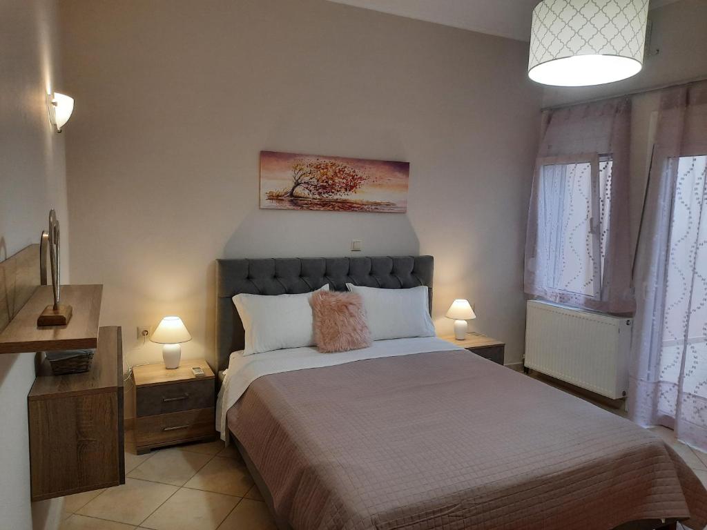 A bed or beds in a room at Pavlos Apartment