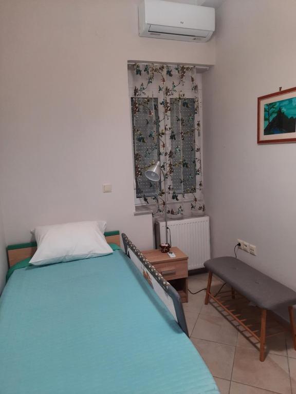 A bed or beds in a room at Pavlos Apartment