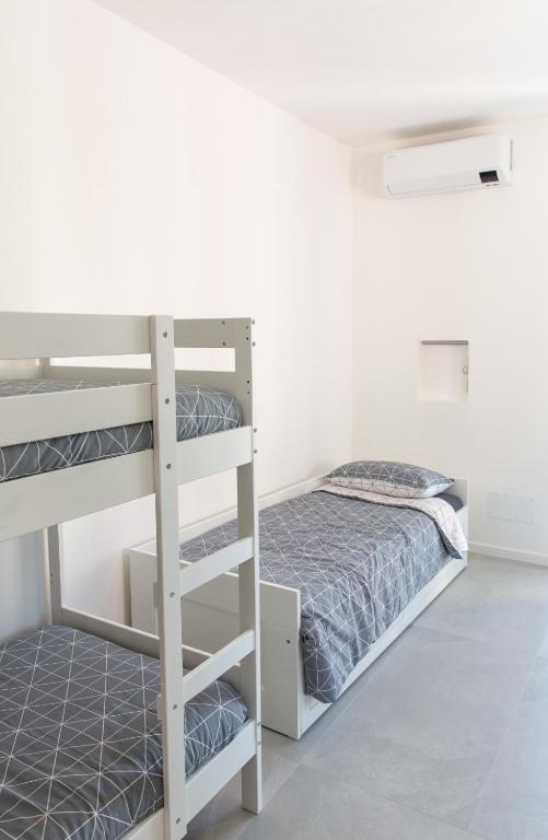 Postel nebo postele na pokoji v ubytování Bed&Biker