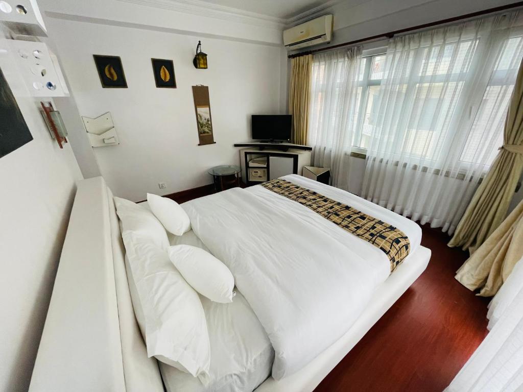 Postel nebo postele na pokoji v ubytování Hotel M Square Pvt.Ltd
