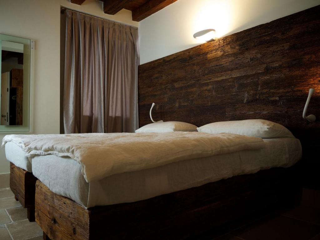 Postel nebo postele na pokoji v ubytování Hotel Antica Abbazia