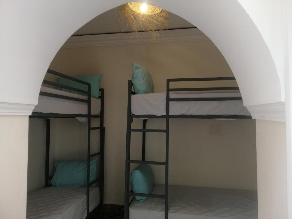 Postel nebo postele na pokoji v ubytování Hostel Laksour