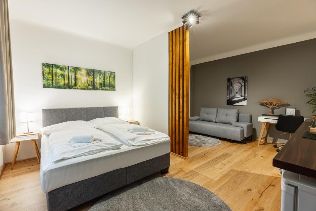 Postelja oz. postelje v sobi nastanitve Cozy Studio Apartment Located in Vienna's Vibrant City Center