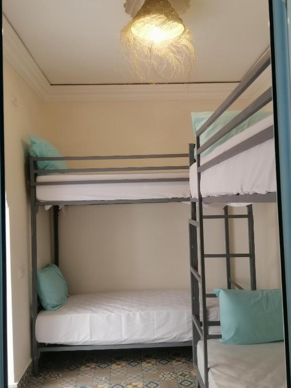 Postel nebo postele na pokoji v ubytování Hostel Laksour