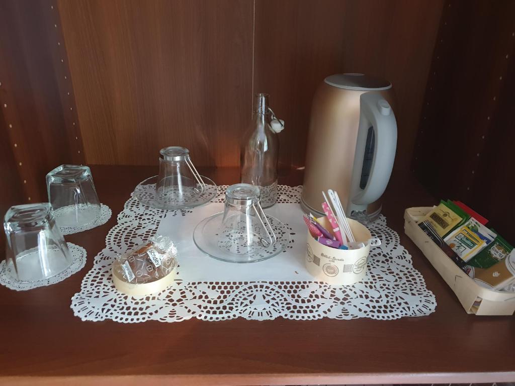 a table with two glasses and a white table cloth at La Villa d&#39;Olivène in Cuers