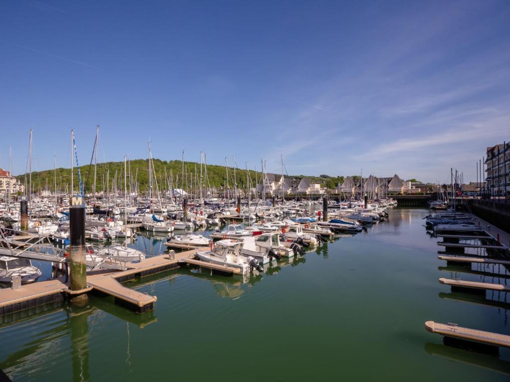 a group of boats docked in a marina at Apartment Port Guillaume-6 by Interhome in Cabourg