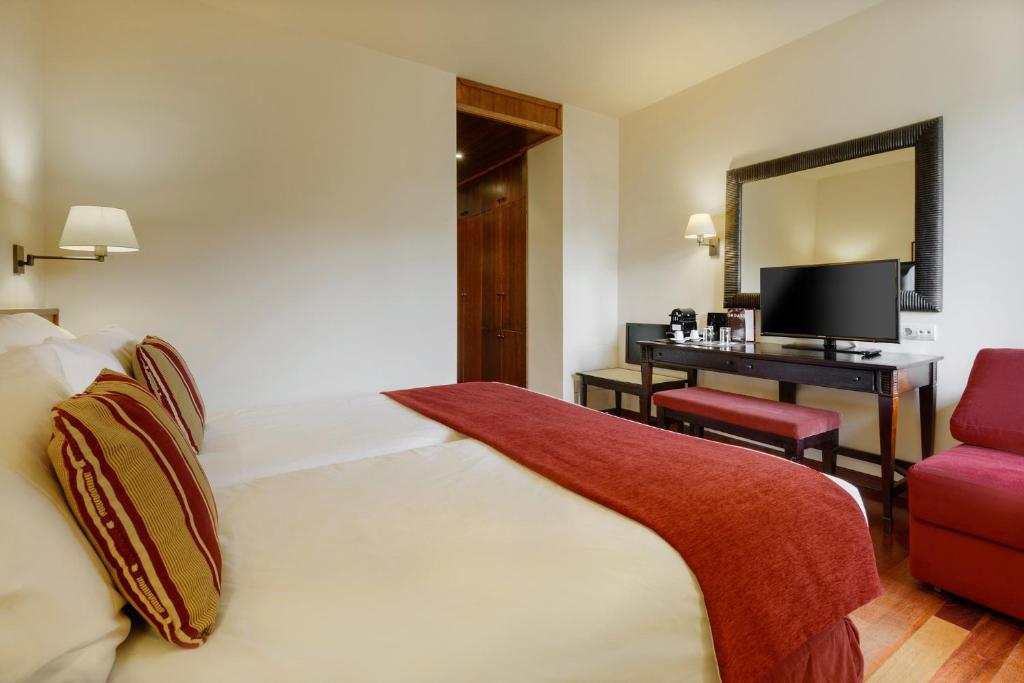 Postel nebo postele na pokoji v ubytování Hotel Saliecho