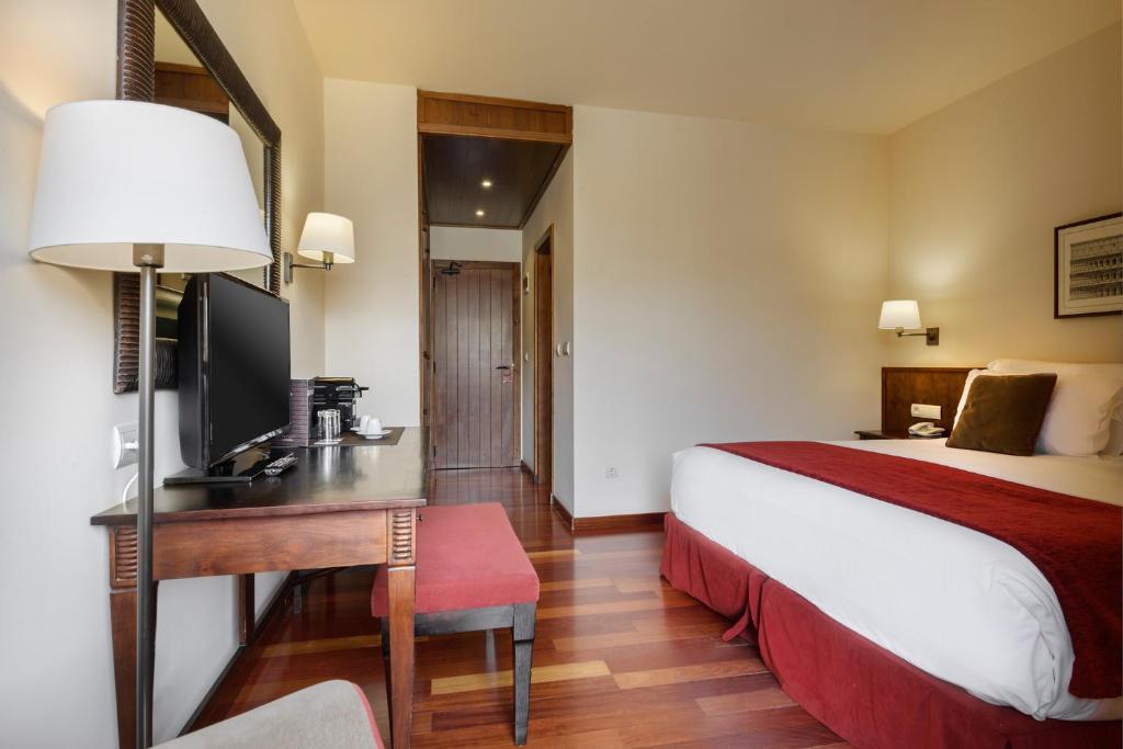 Postel nebo postele na pokoji v ubytování Hotel Saliecho