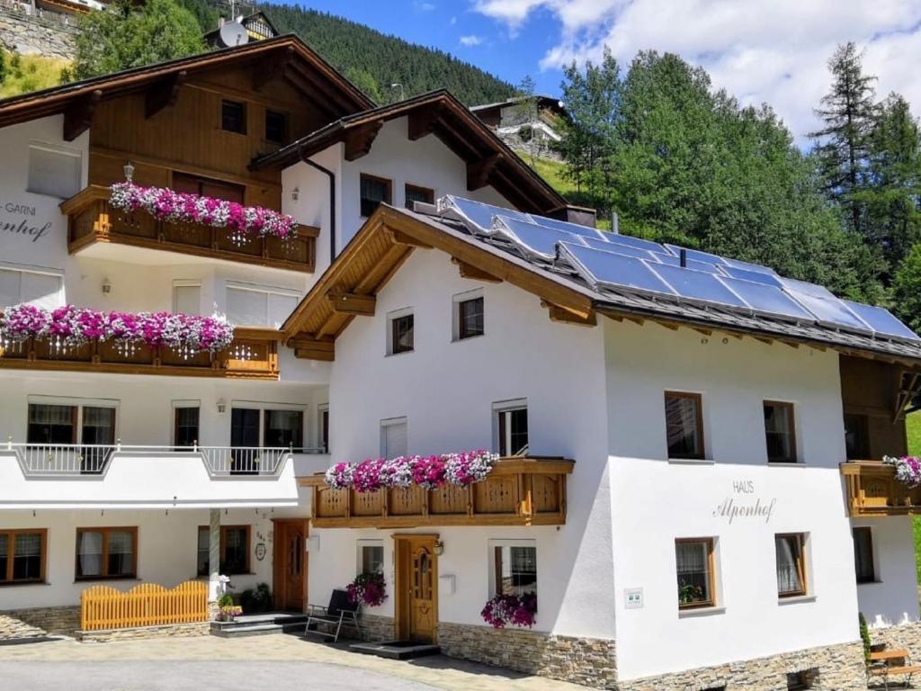 a house with solar panels on its roof at Apartment Alpenhof-1 by Interhome in Sinsen