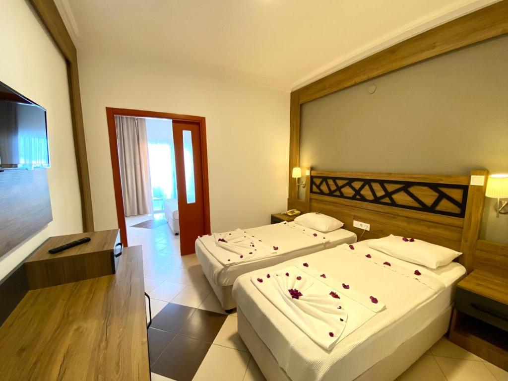 A bed or beds in a room at İstanbul Beach Hotel