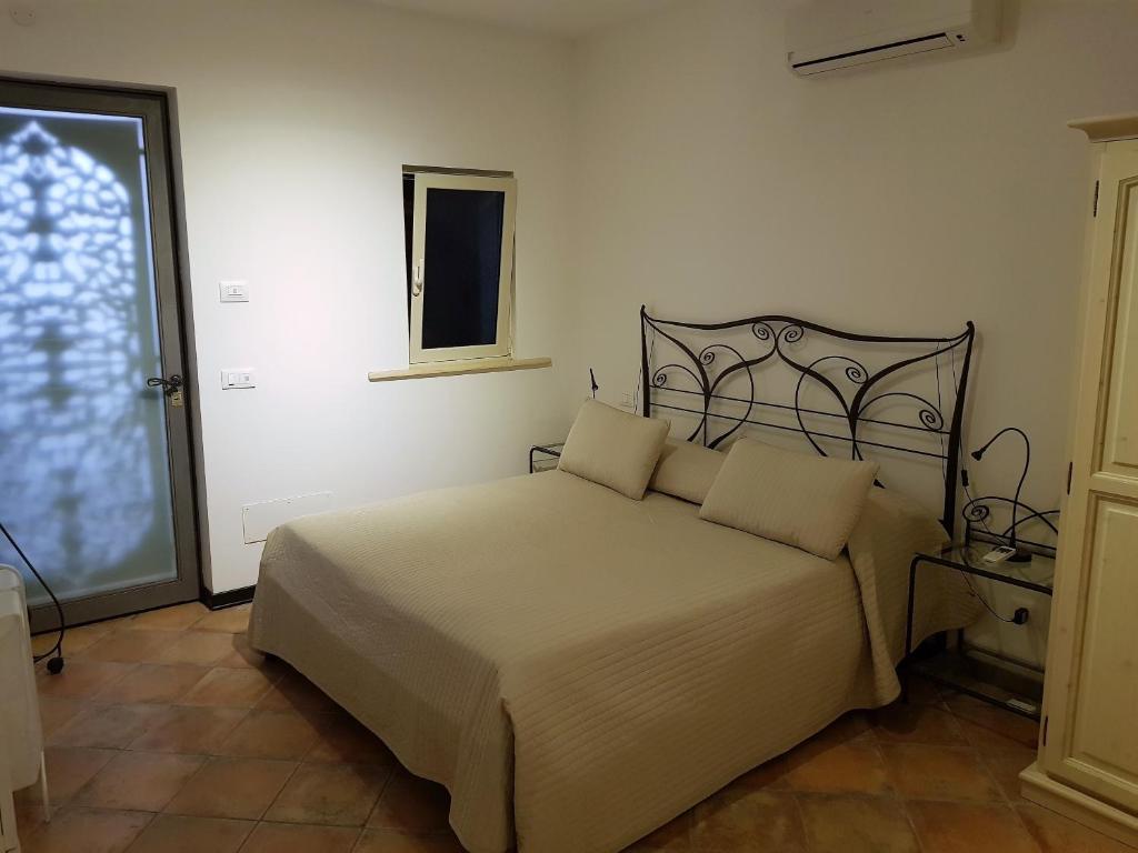 Posteľ alebo postele v izbe v ubytovaní Giasone Apartments