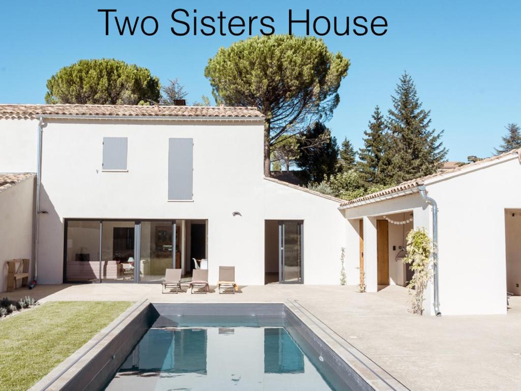 a house with a swimming pool and a house with two sisters house at Two Sisters House, Private pool & bike storage, Mont-Ventoux, lac Palivettes, Child-friendly in Malaucène