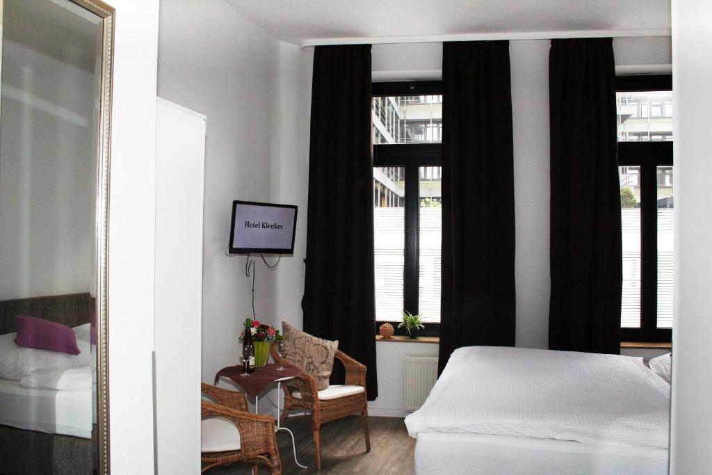 Postel nebo postele na pokoji v ubytování Hotel Klenkes am Bahnhof