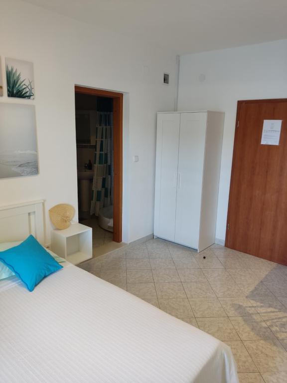Postel nebo postele na pokoji v ubytování Apartmani Matiša