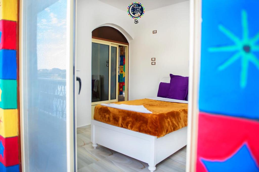Postel nebo postele na pokoji v ubytování Onaty Ka Guest House