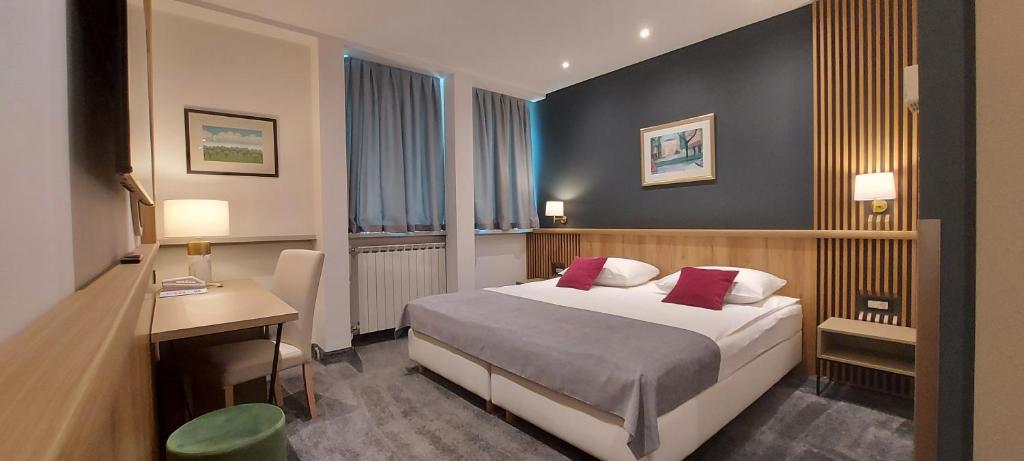 Postel nebo postele na pokoji v ubytování Hotel Central