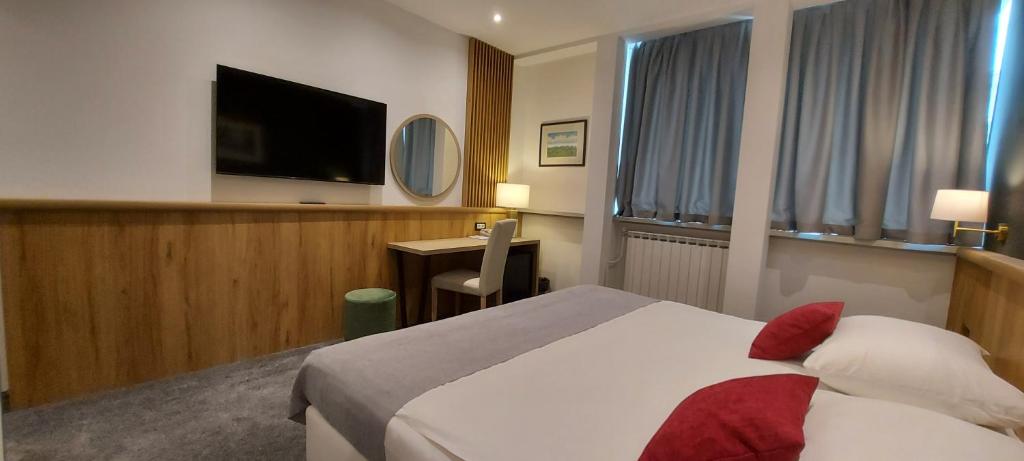 Postel nebo postele na pokoji v ubytování Hotel Central