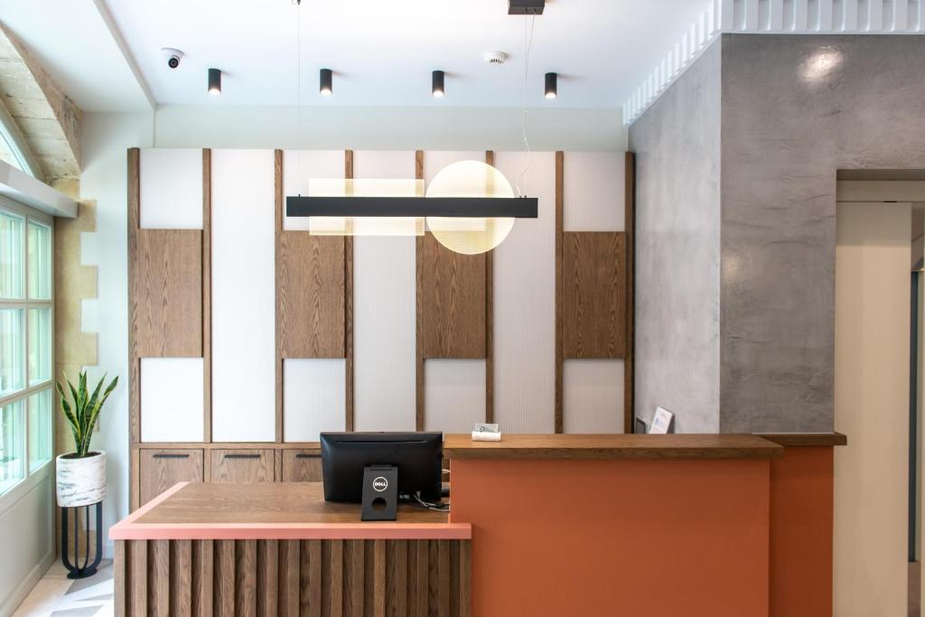 an office with a reception desk in a lobby at El Greco Hotel in Chania Town