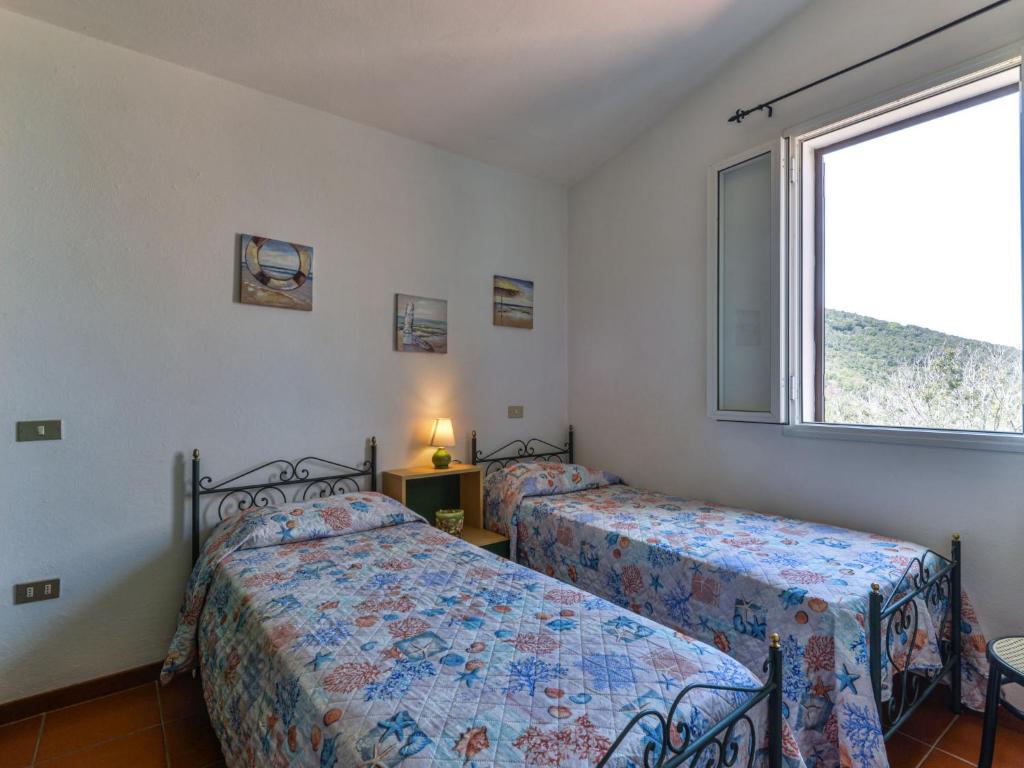 A bed or beds in a room at Apartment La Paradisa-1 by Interhome