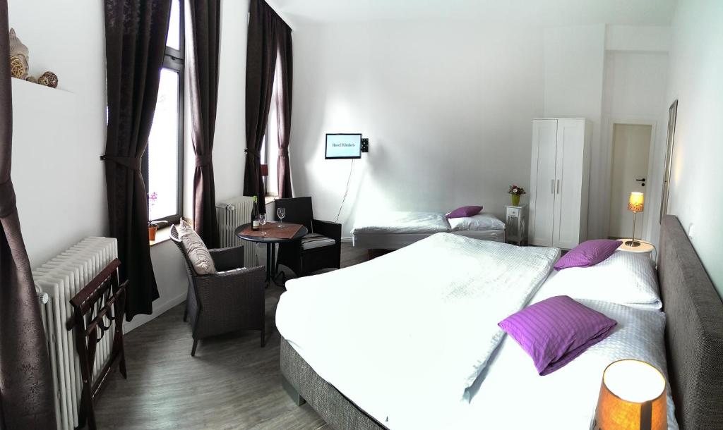 Postel nebo postele na pokoji v ubytování Hotel Klenkes am Bahnhof