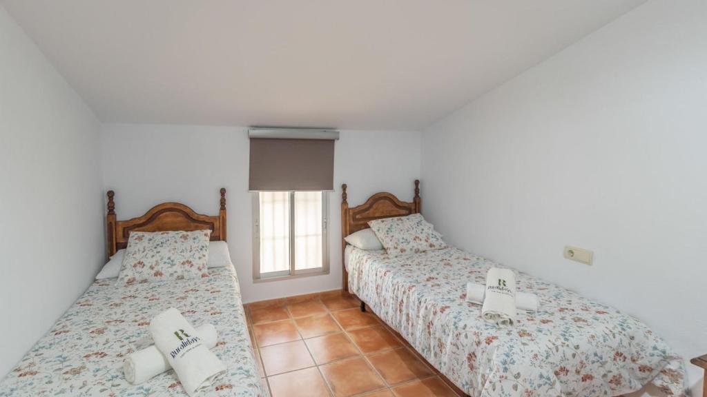 Posteľ alebo postele v izbe v ubytovaní Casa Los Baenas Casabermeja by Ruralidays