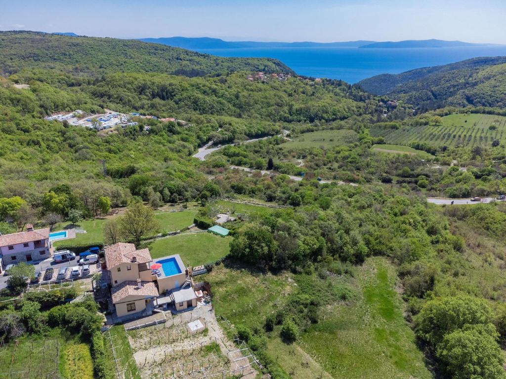 an aerial view of a house on a hill with the ocean at Holiday Home Panorama 1 by Interhome in Labin