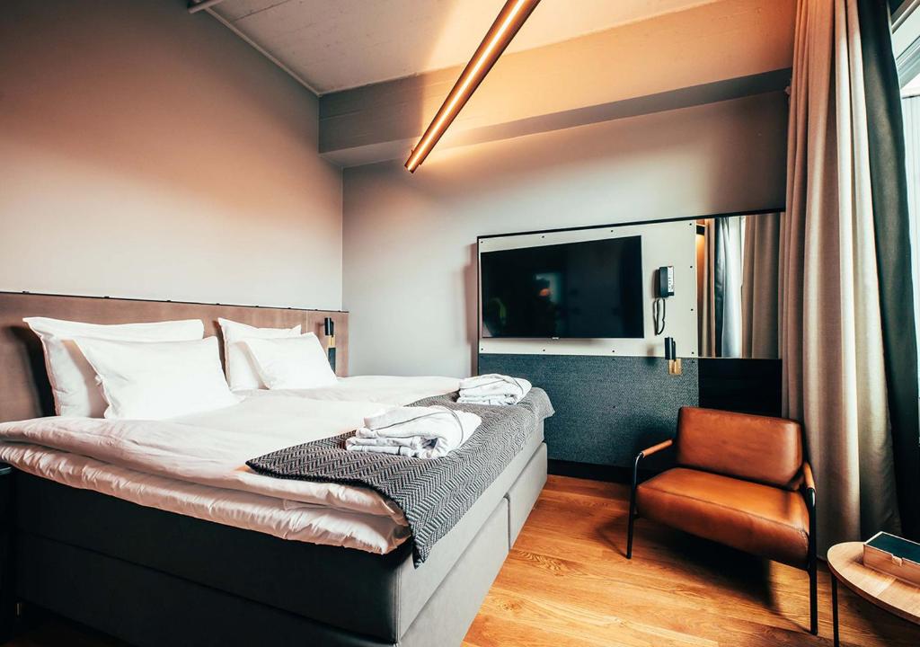 Postel nebo postele na pokoji v ubytování Clarion Hotel Mestari