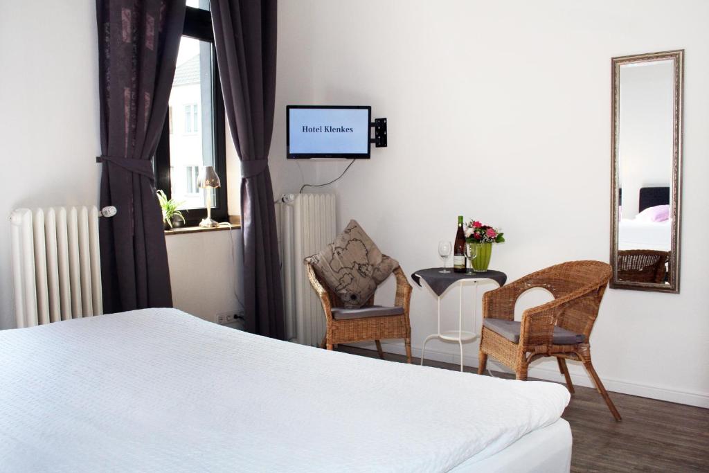 Postel nebo postele na pokoji v ubytování Hotel Klenkes am Bahnhof