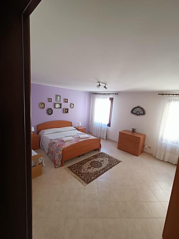 Postel nebo postele na pokoji v ubytování Casa sul Cielo di Burano
