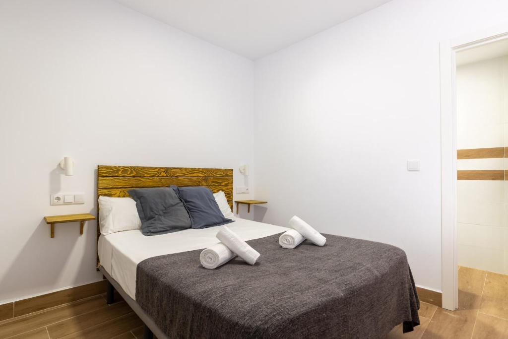 Posteľ alebo postele v izbe v ubytovaní FUN BUILDING STUDIOS by HOMEABOUT