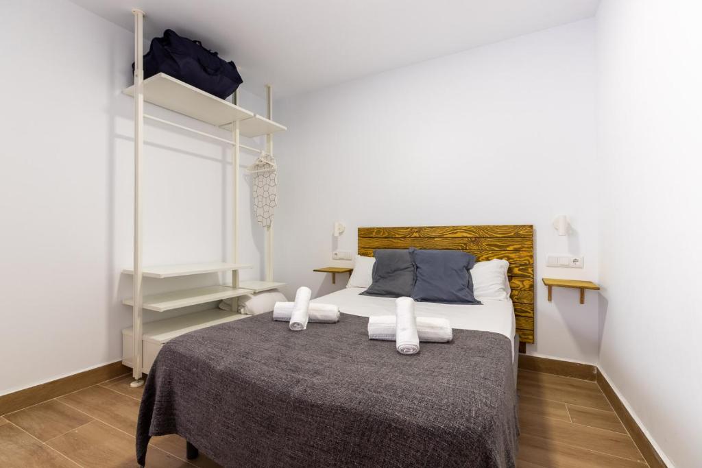 Posteľ alebo postele v izbe v ubytovaní FUN BUILDING STUDIOS by HOMEABOUT