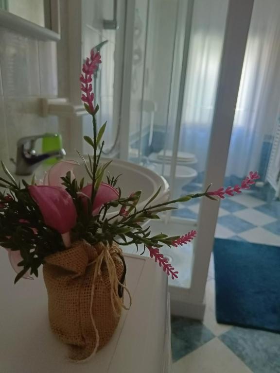Postel nebo postele na pokoji v ubytování Casa sul Cielo di Burano